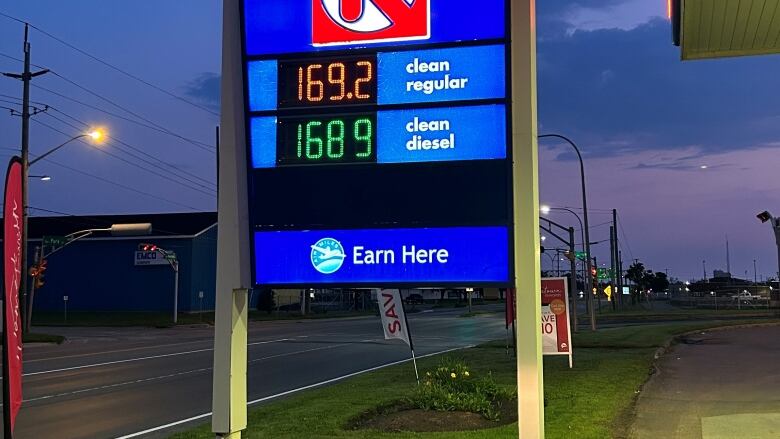 Sign showing price of gas and diesel.