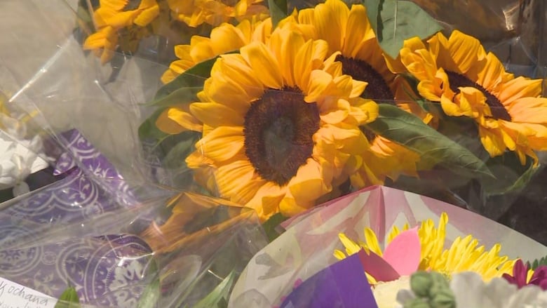 Flowers left at the spot where Huebner-Makurat was shot and killed.