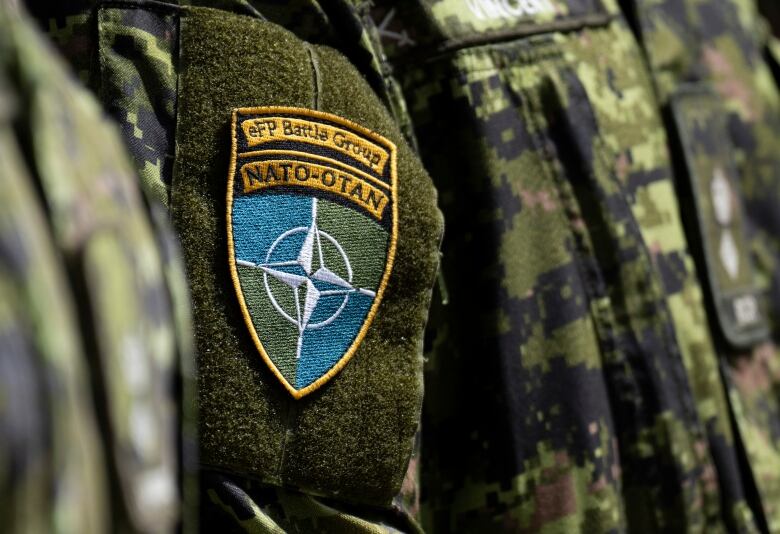 A patch for the North Atlantic Treaty Organization is seen on a soldier's military outfit.