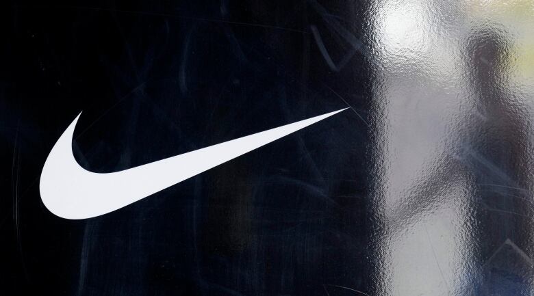 In this photo taken Sept. 20, 2011, the Nike logo is displayed at a Nike store in South Miami. Nike Inc., releases quarterly financial results Thursday, Sept. 22, 2011, after the market close. 