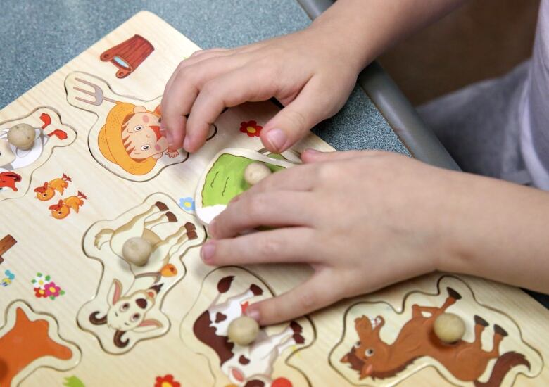 Child with puzzle.