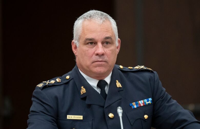 Acting RCMP Commissioner Mike Duheme waits to appear before the Procedure and House Affairs committee, in Ottawa, Tuesday, June 13, 2023.