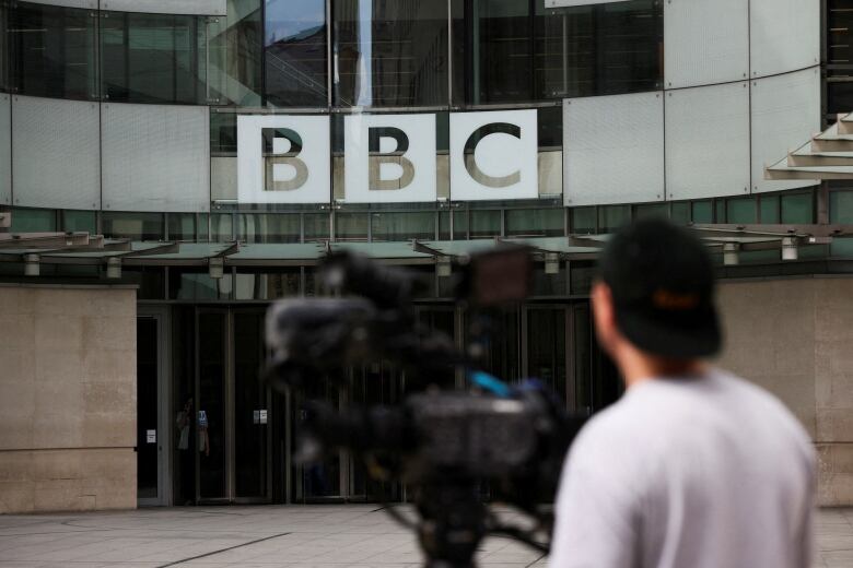 Members of the media work outside the BBC headquarters in London, Britain, July 10, 2023. 