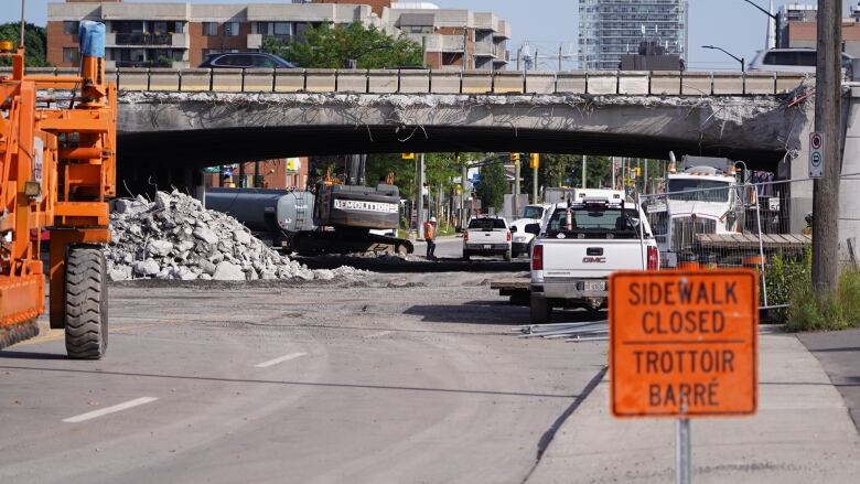 A highway overpass with construction underneath.