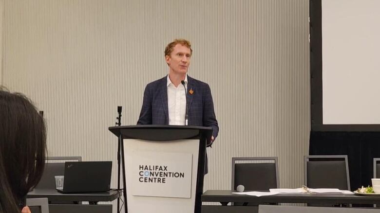 A man standing at a podium.