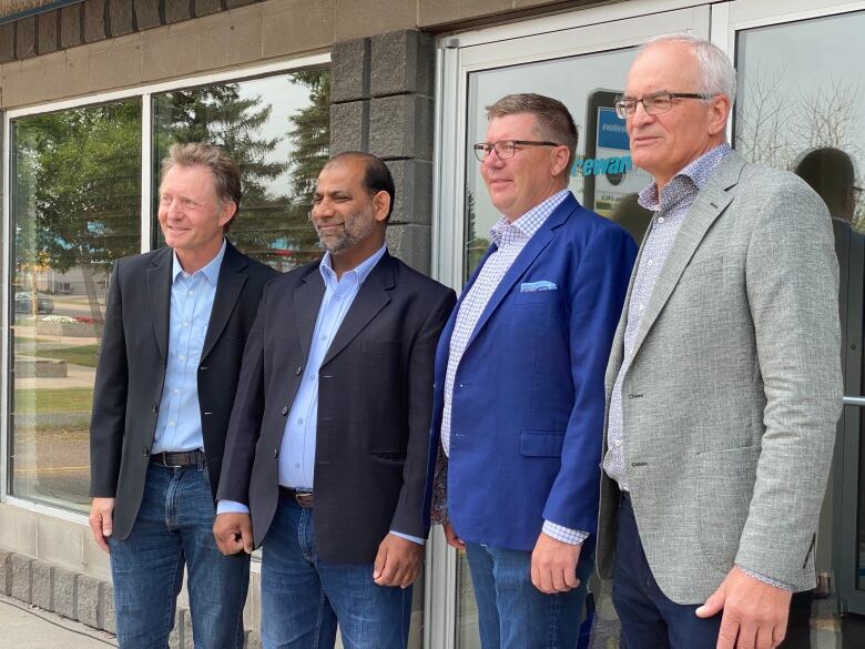 Premier Scott Moe stands with three Saskatchewan party byelection candidates, from left to right: Nevin Markwart (far left), Riaz Ahmad (second from left), Blaine McLeod (right).