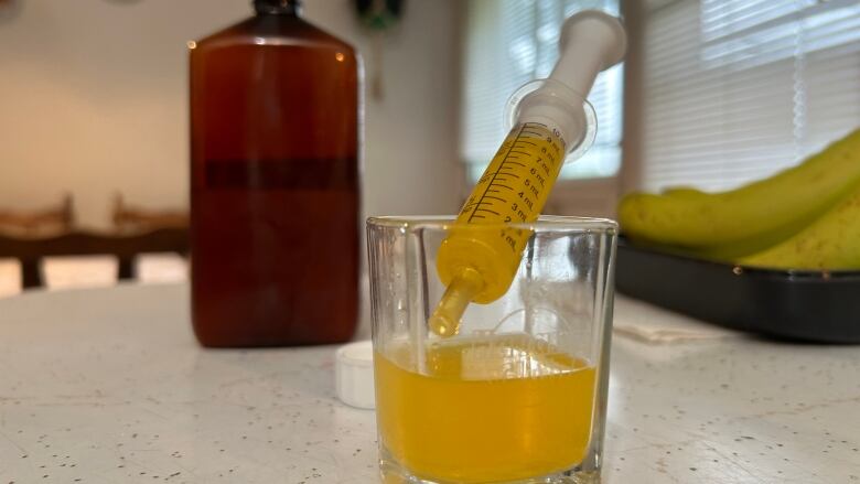 bottle with bright yellow liquid