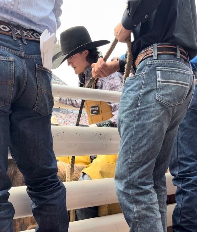 A man wearing a cowboy hat is pictured.