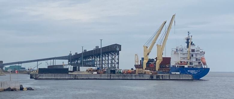 A ship getting loaded with cargo