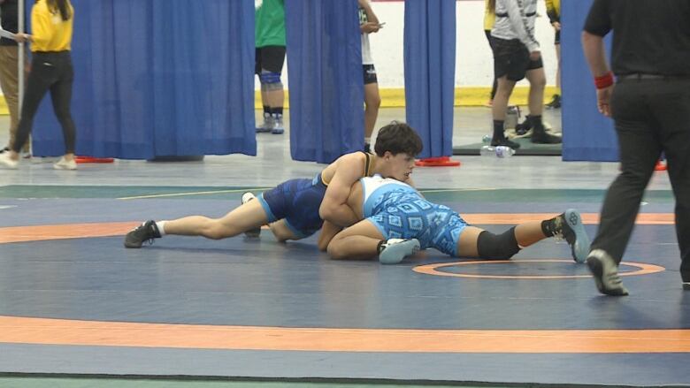 Maddex McGrath grapples with an opponent from New Mexico at the North American Indigenous Games in Halifax.