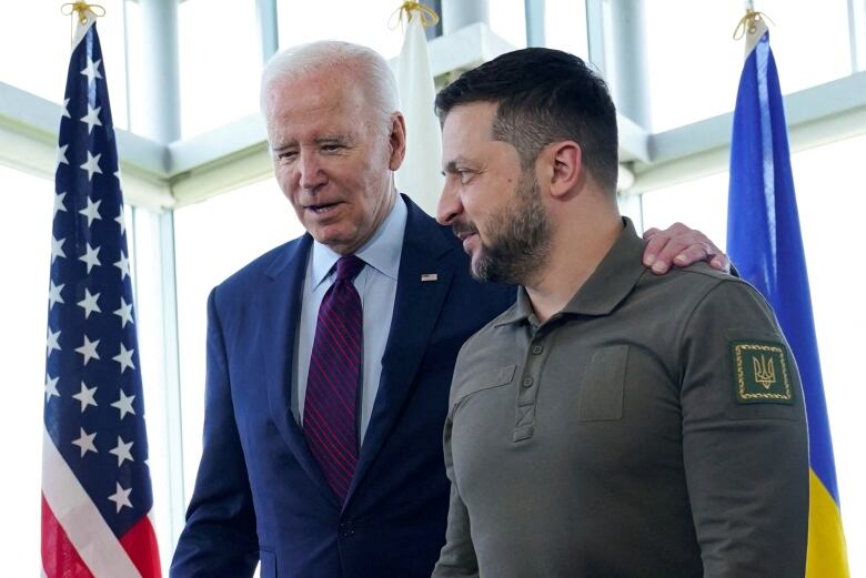 President Joe Biden, walks with Ukrainian President Volodymyr Zelenskiy ahead of a working session on Ukraine during the G7 Summit in Hiroshima, Japan, Sunday, May 21, 2023