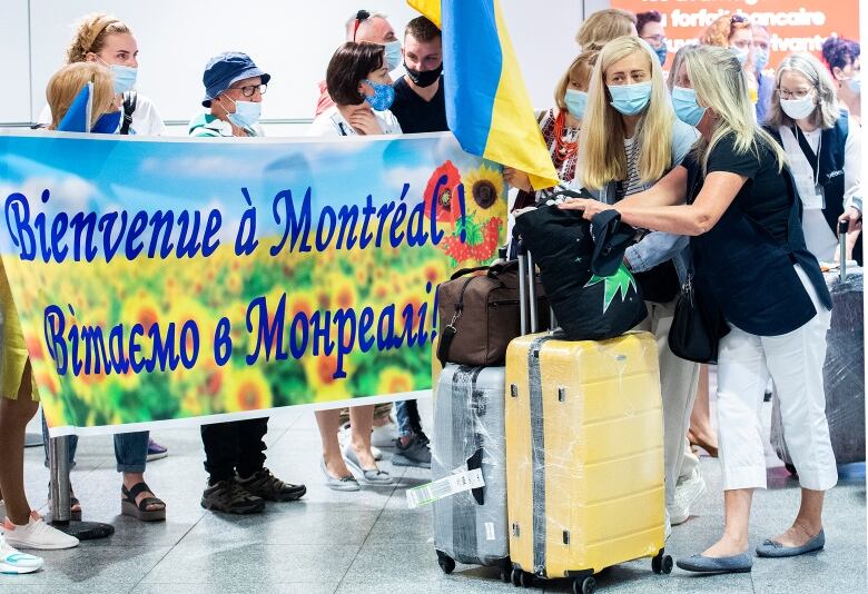 Ukrainian nationals fleeing the ongoing war in Ukraine arrive at Trudeau Airport in Montreal