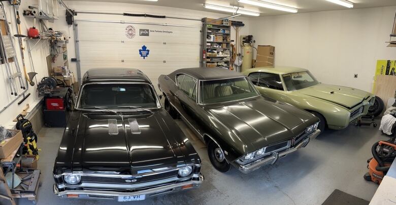 A black 1969 Nova L78, green 1968 Beaumont Survivor, and 1969 GTO RAIII in a garage. 