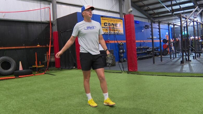 A baseball player preparing to throw a baseball. 