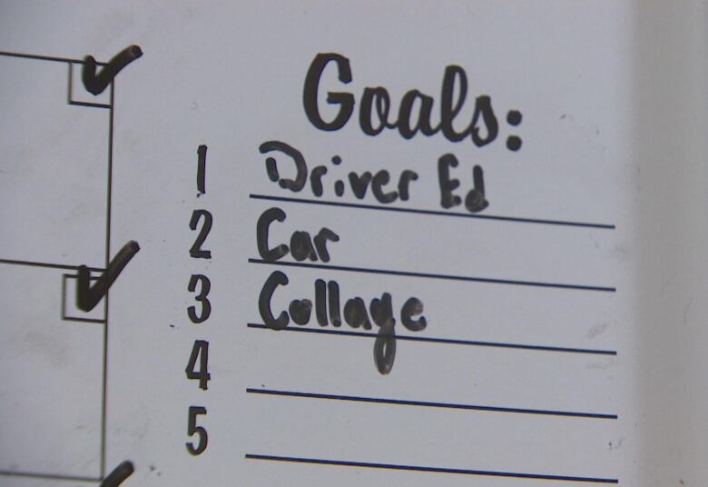 Three items on whiteboard with black marker (Driver's Ed, Car College).