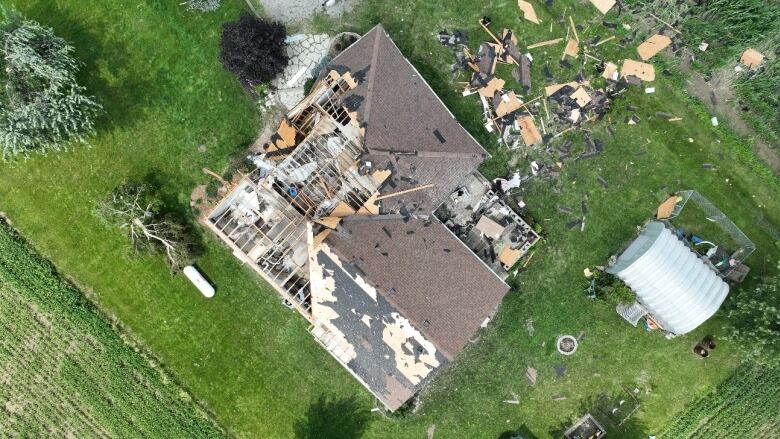 A view from above of a damaged home caused by a tornado