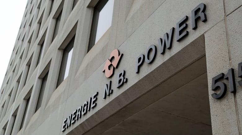 Company's name on the side of a stone building.