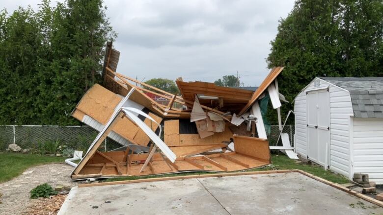 Ground photo of worst damage seen in drone image in Blenheim, Ont. The shed was nailed and anchored to the foundation.