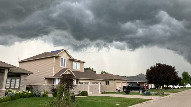 Dark clouds over some homes. 