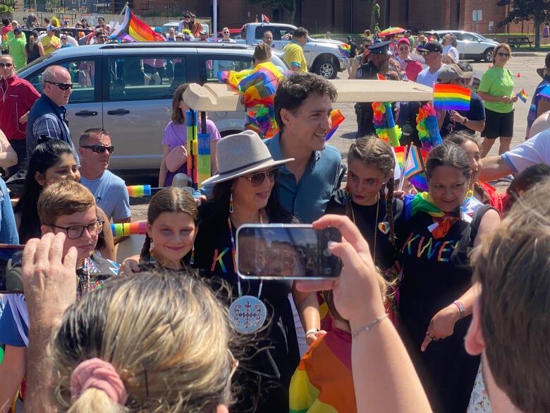 Trudeau poses with Jenene Wooldridge, Julie Pellessier-Lush and other members of the Mi'kmaw community at the Pride parade.