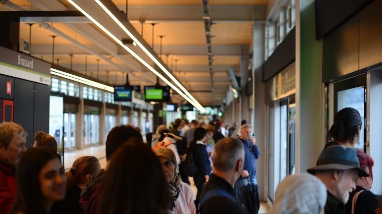 a train terminal filled with curious passengers