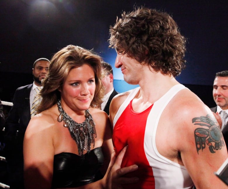 Liberal MP Justin Trudeau stands with his wife Sophie Grgoire after he won a boxing match against Conservative Senator Patrick Brazeau during charity boxing match for cancer research Saturday, March 31, 2012 in Ottawa. 