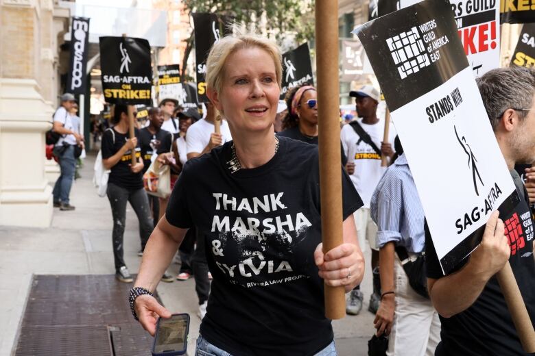 Cynthia Nixon joins other SAG-AFTRA members on the picket line in New York City.