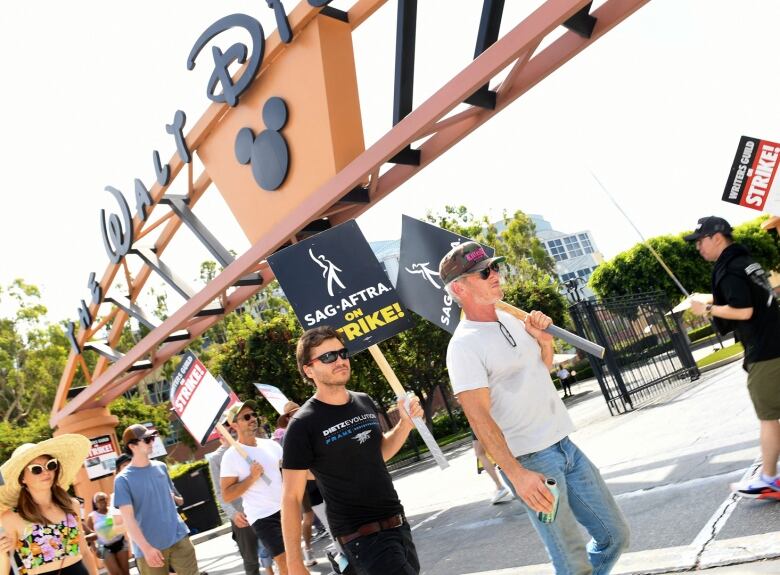 Actor Sean Penn with others on a picket line outside Walt Disney Studios in Burbank, Calif.