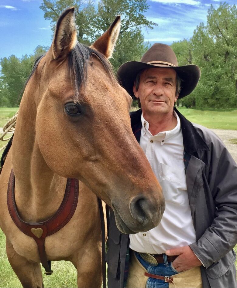 Mike McLean is pictured with his horse Sanchez.