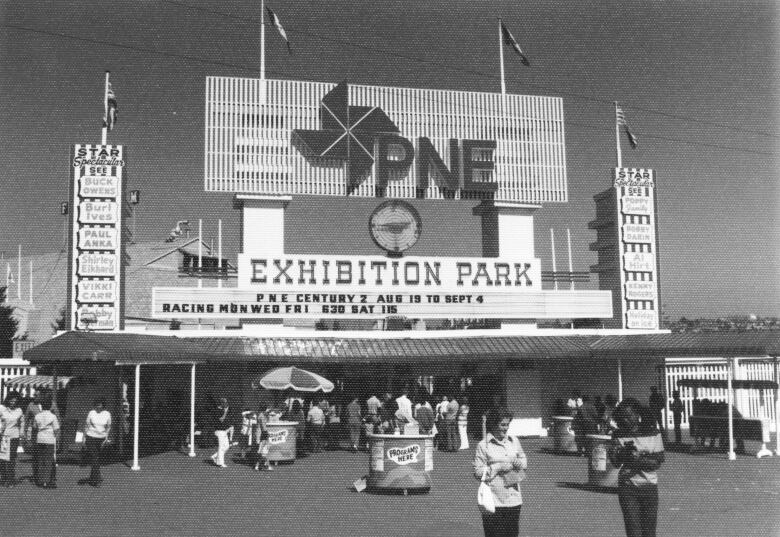 People seen coming and going through the gates of the PNE Exhibition Park in this grainy black and white photo from 1972