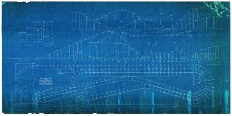 A sheet of blue paper with markings in the shape of the wooden roller-coaster. 