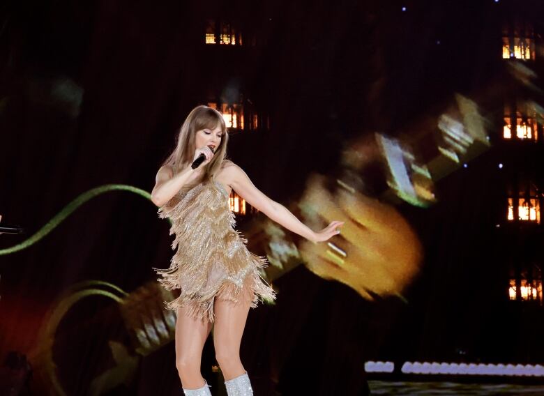 Taylor Swift performing on stage.