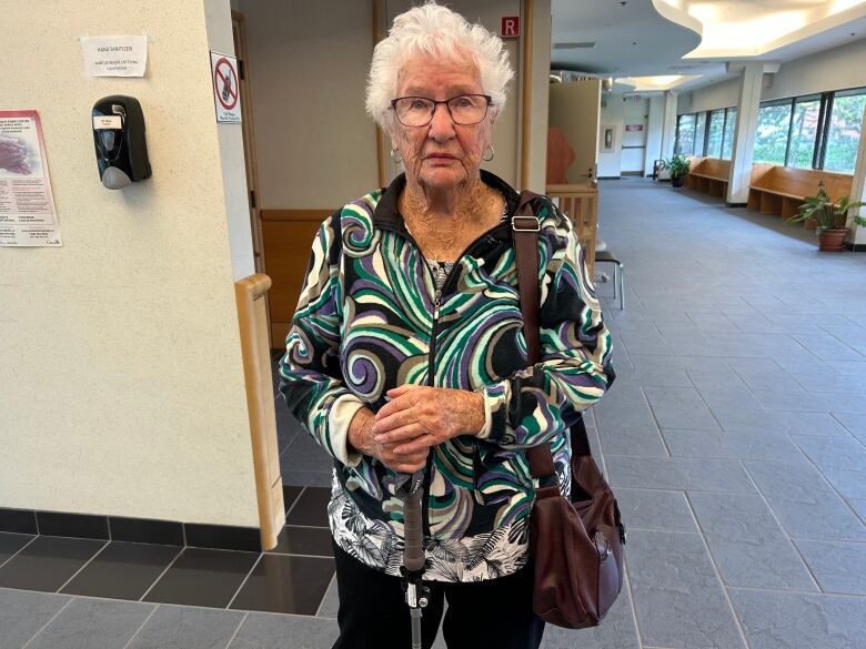 Peg Gallant wears a pattered shirt as she looks at the camera. 