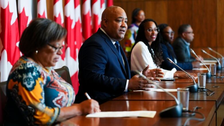 Liberal member of Parliament Michael Coteau speaks as he joins fellow Members of the Canadian Congress of Black Parliamentarians as they hold a press conference following their first  summit in Ottawa on Friday, Aug. 11, 2023. The Congress is a non-partisan forum with the aim of building consensus and proposing solutions to better the lives of Black Canadians.  THE CANADIAN PRESS/Sean Kilpatrick