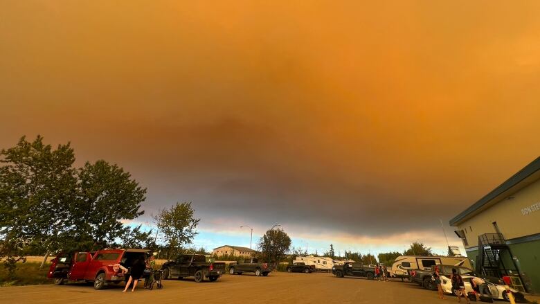 Smoke in the sky above vehicles