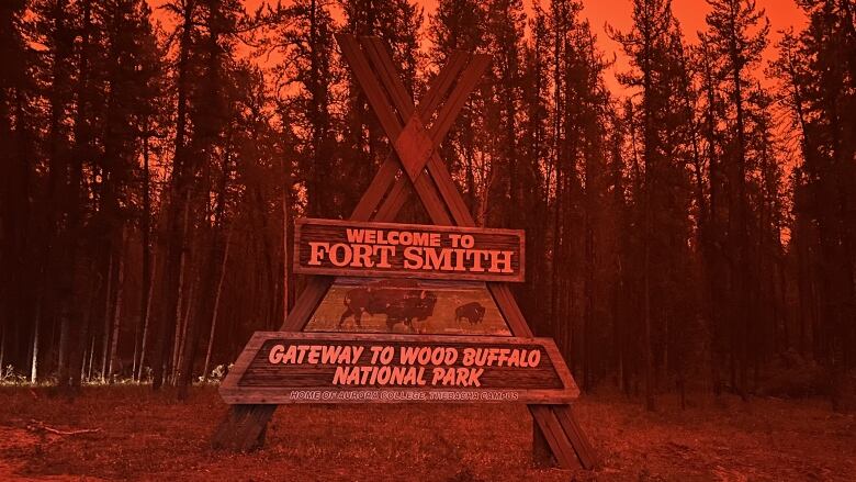 Fort Smith municipal sign with red skies.