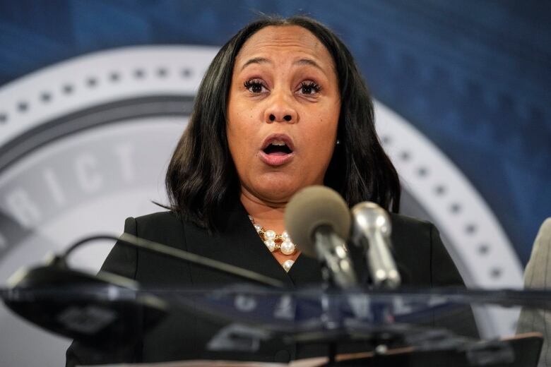 Fulton County District Attorney Fani Willis speaks in the Fulton County Government Center during a news conference, Monday, Aug. 14, 2023, in Atlanta. Donald Trump and several allies have been indicted in Georgia over efforts to overturn his 2020 election loss in the state. (AP Photo/John Bazemore)