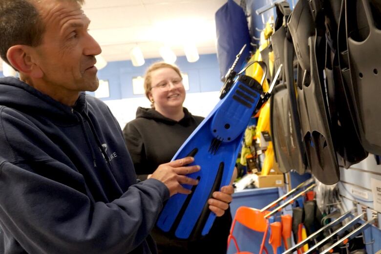 George Mueller hired Alanna McIntyre to work in his dive shop, after she quit her job as a primary care paramedic and became interested in scuba diving.