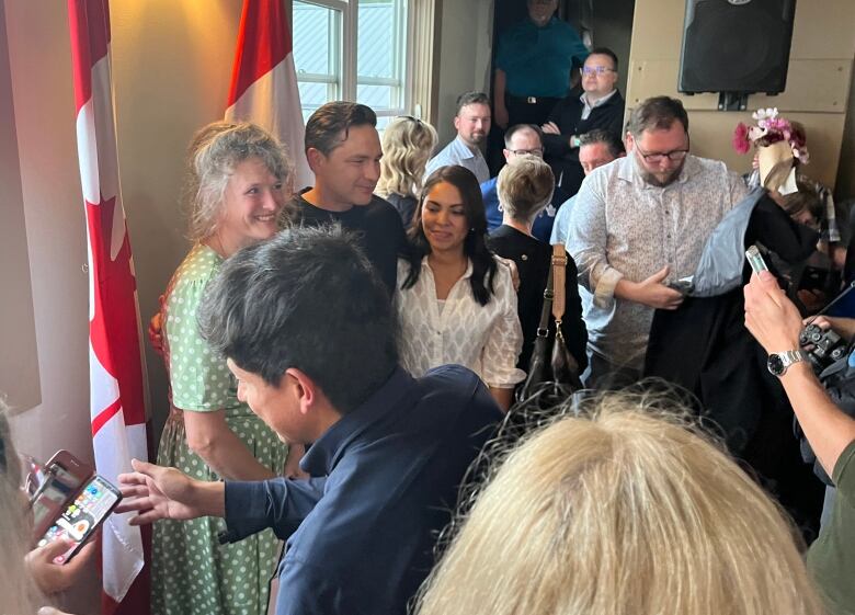 Pierre Poilievre and his wife Anaida (in white shirt) took time to pose for photos with many of those who attended the rally.