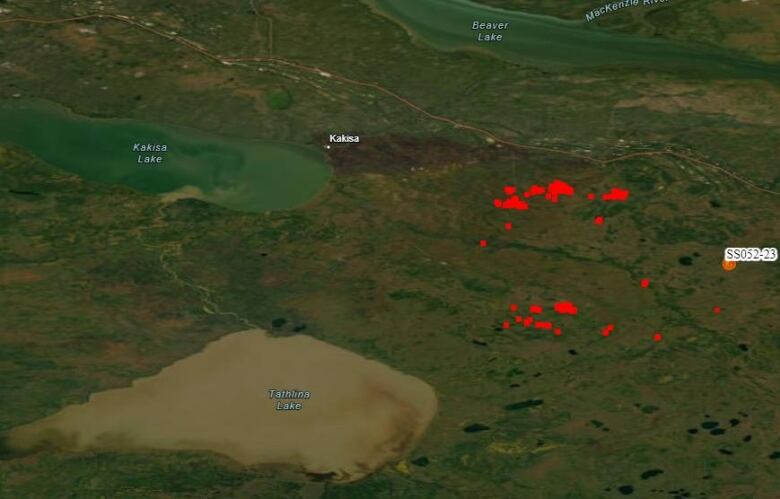 A satellite image shows Kakisa, Kakisa Lake, and some red markings indicating wildfire.