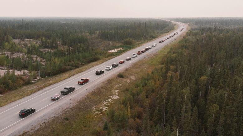 A line of cars on Highway 3, the only highway in or out of Yellowknife, after an evacuation order was given.