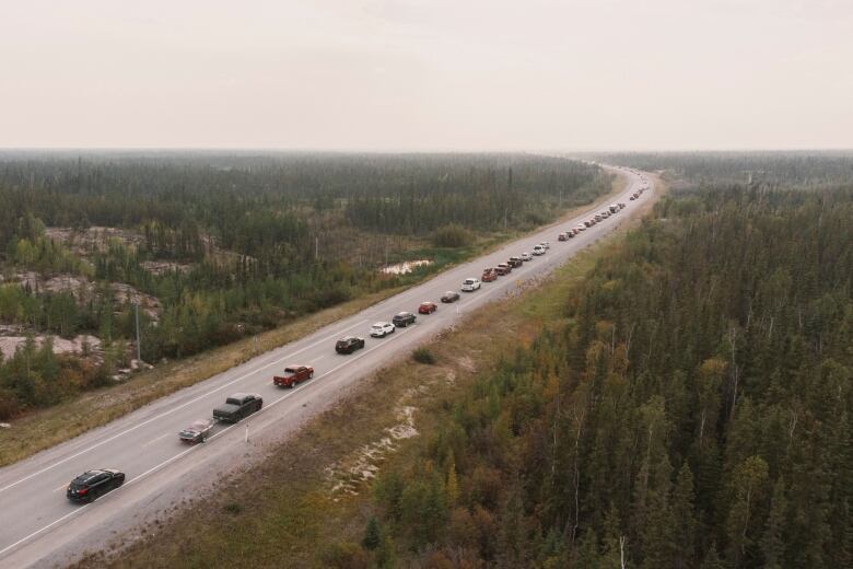 A line of cars on Highway 3, the only highway in or out of Yellowknife, after an evacuation order was given.