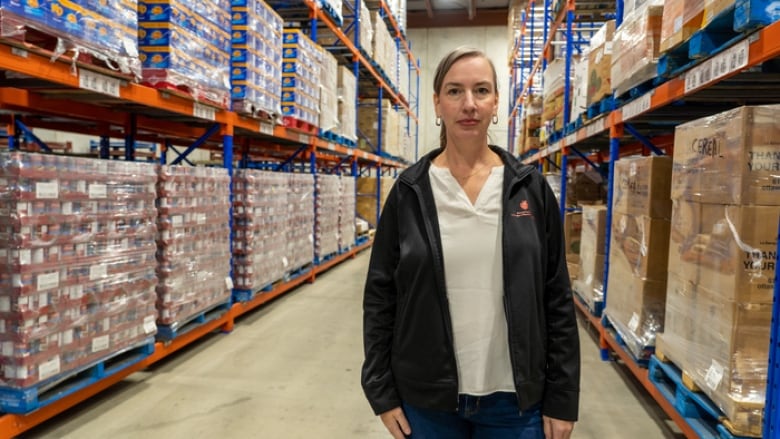 A woman in a warehouse