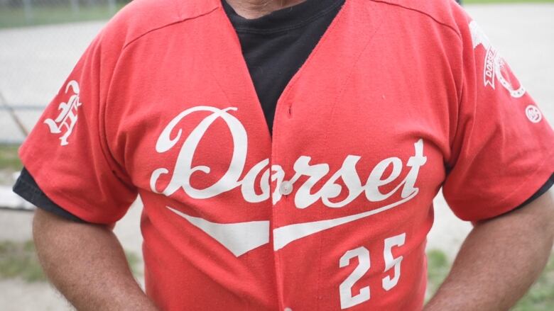 A close up of a baseball jersey that says Dorset.