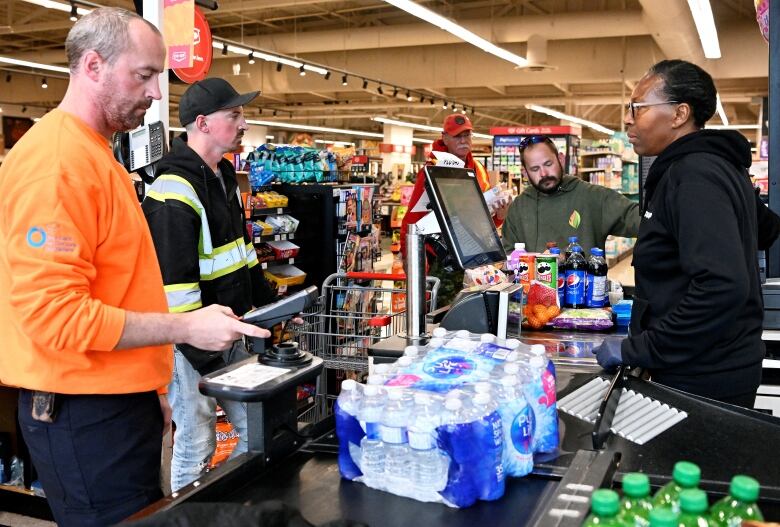 Man at a grocery checkout.