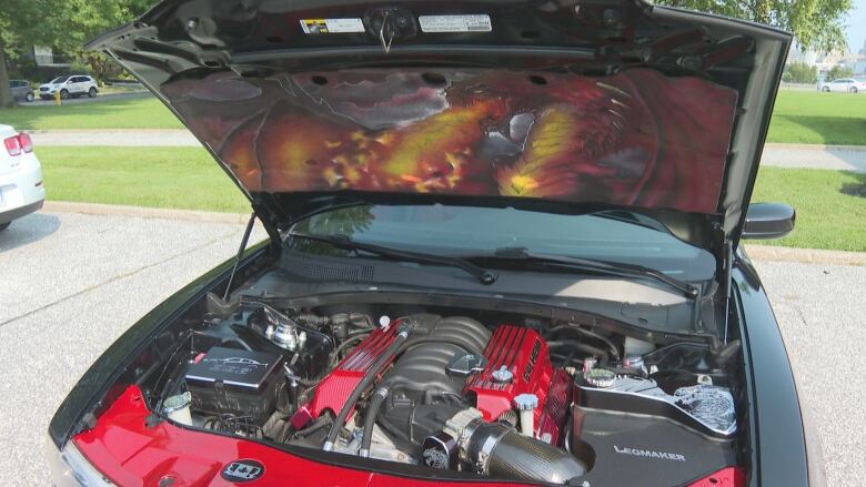 A look inside the hood at the motor of Diane Leonard-Humphrey's 2013 Dodge Charger.