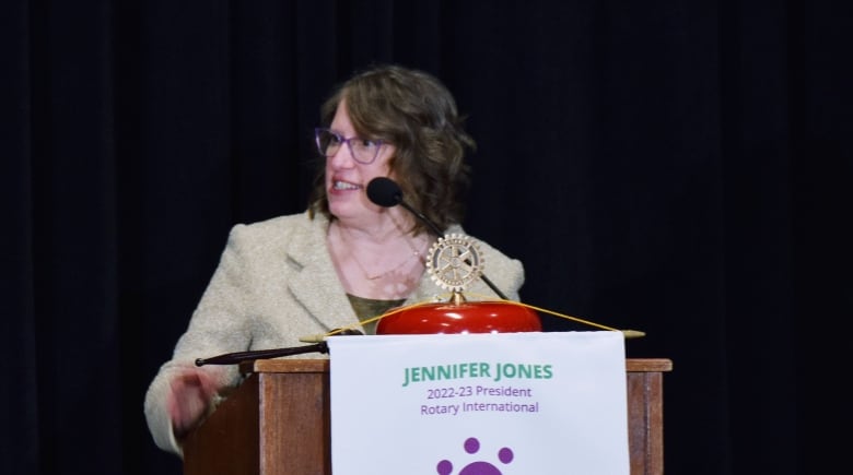 Woman at podium giving speech