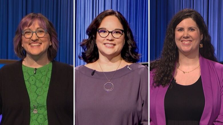 Three women stand in front of a blue background smiling at the camera.