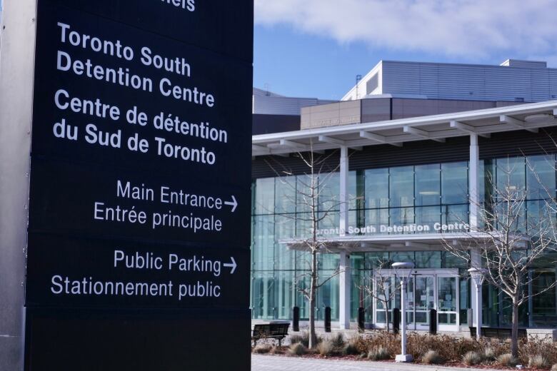 The exterior of a building with a sign reading Toronto South Detention Centre. 