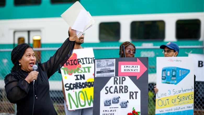 Andrea Hazell, Scarborough-Guildwood MPP, speaks in Scarborough on Aug. 23, 2023. Transit users, community organizers, and Scarborough MPPs gathered near the site of the Scarborough Rapid Transit derailment to hold a memorial for the transit line and rally for solutions.